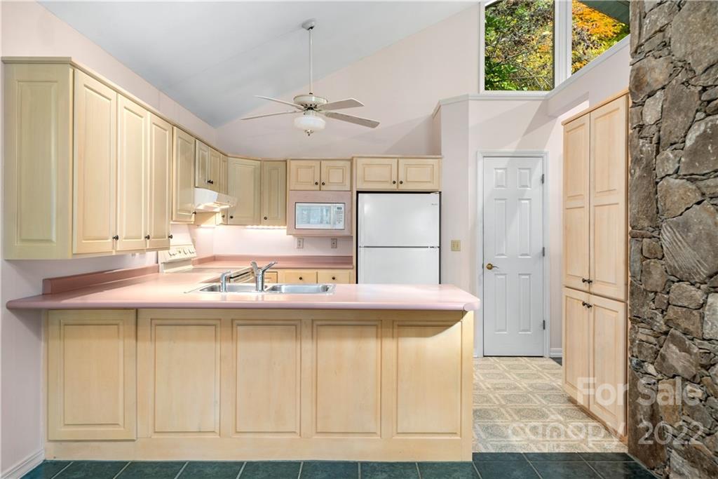 592 Mouzon Road Waynesville, NC 28785 - Photo 7 of 38 a kitchen with kitchen island and stainless steel appliances