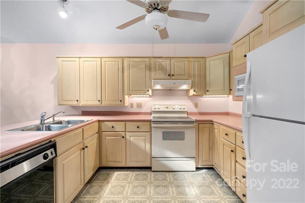592 Mouzon Road Waynesville, NC 28785 - Photo 8 of 38 a kitchen with a sink stove and cabinets