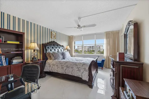 a bedroom with a bed wooden floor and a window