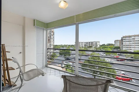 a view of a balcony and floor to ceiling windows
