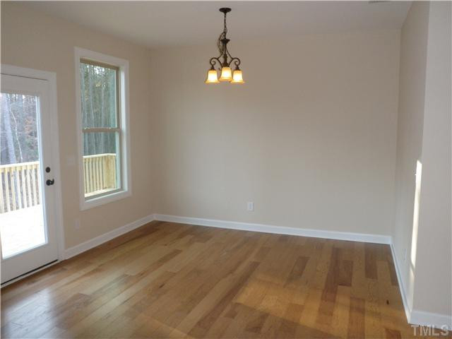 4854 Inwood Road Raleigh, NC 27603 - Photo 9 of 20 Breakfast room with hardwood floors and great views of the private backyard