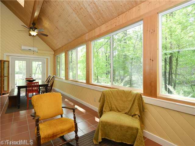 8102 Hunting Cog Road Oak Ridge, NC 27310 - Photo 3 of 16 Sunroom.