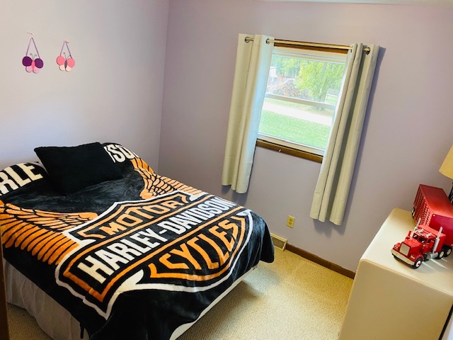 926 McCoy Road Amboy, IL 61310 - Photo 14 of 25 a bedroom with a bed and a window