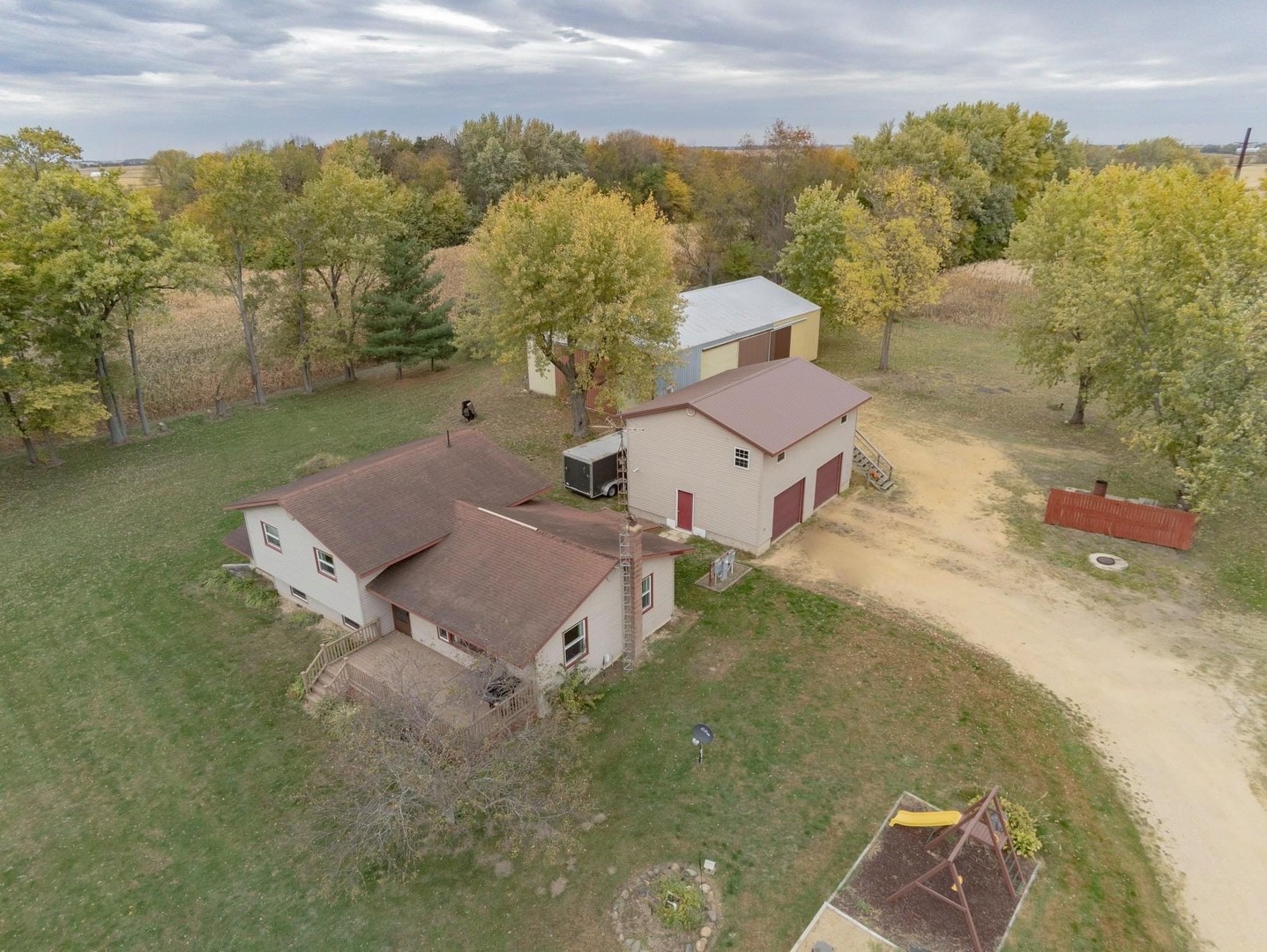 926 McCoy Road Amboy, IL 61310 - Photo 3 of 25 an aerial view of a house with a yard