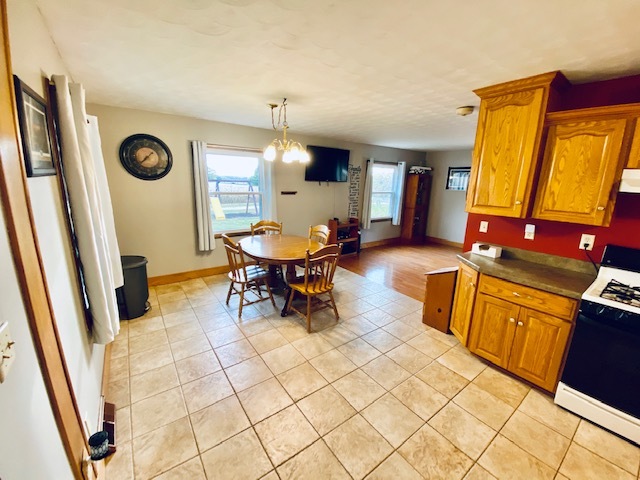 926 McCoy Road Amboy, IL 61310 - Photo 8 of 25 a living room with furniture a table and a large mirror