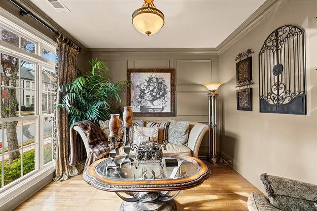 a living room with furniture and windows