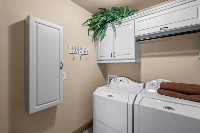 a view of walk in closet with clothes