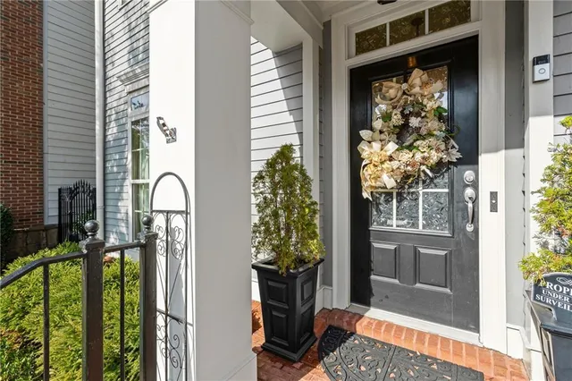 a dining room with furniture and chandelier