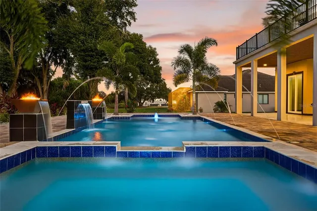 a bathroom with a shower and a table