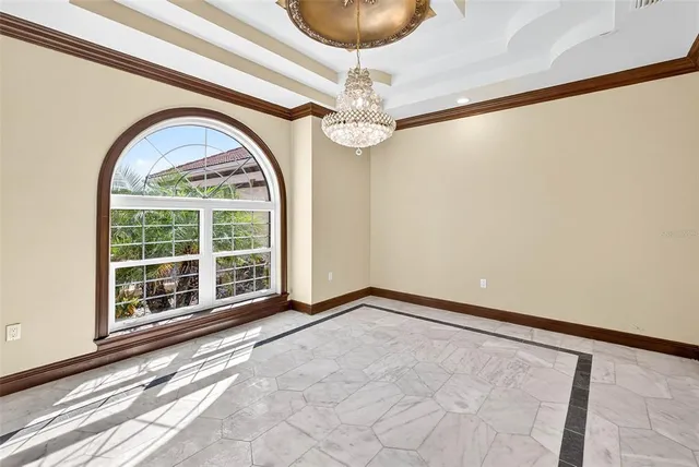 a view of room with wooden floor and ceiling fan