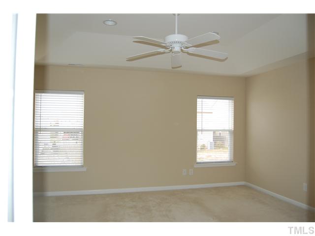 117 Steam Engine Way Garner, NC 27529 - Photo 11 of 21 Master Bedroom features a trey ceiing, recessed lighting, & ceiling fan.