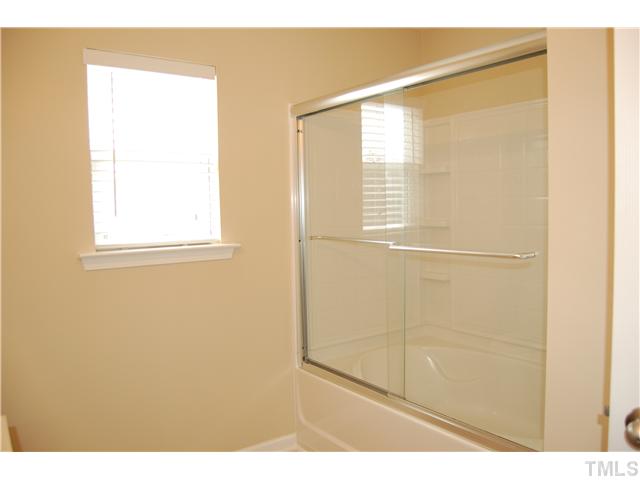 117 Steam Engine Way Garner, NC 27529 - Photo 14 of 21 Master Bath garden tub/shower with recessed light over tub. Linen closet in master bathroom as well.