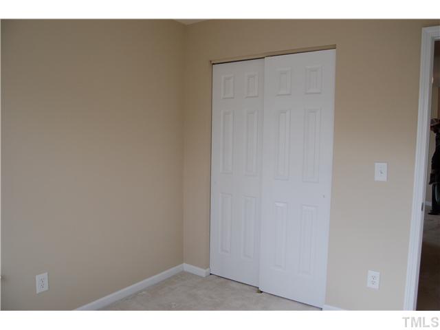 117 Steam Engine Way Garner, NC 27529 - Photo 16 of 21 Double door closets in both secondary bedrooms.