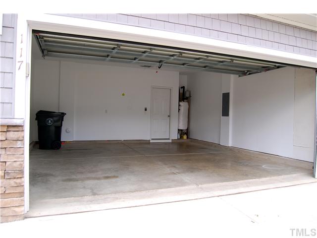 117 Steam Engine Way Garner, NC 27529 - Photo 18 of 21 2-car garage, complete with sheetrock & paint. Easy access from garage into mud room/laundry room space.