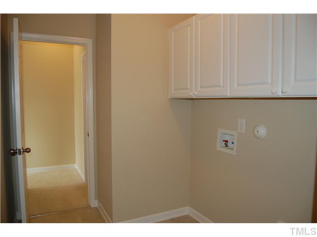 117 Steam Engine Way Garner, NC 27529 - Photo 8 of 21 Wonderfully functional laundry room complete with cabinets above washer/dryer & access to garage.
