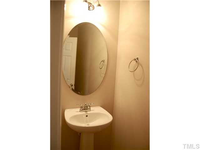 117 Steam Engine Way Garner, NC 27529 - Photo 9 of 21 Private half-bath on 1st floor with classic pedestal sink.