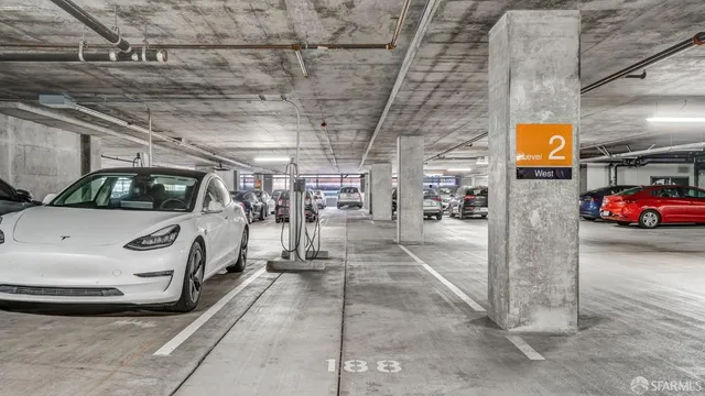view of a balcony with two chairs and a table