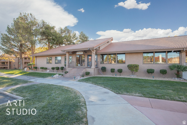 860 South Village Road, Unit A6 St. George, UT 84770 - Photo 15 of 41 Mediterranean / spanish home with stucco siding, a tiled roof, and a front lawn