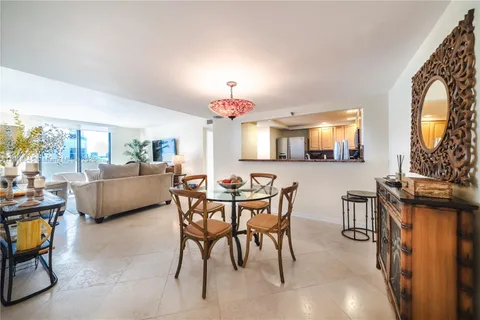 a view of a dining room with furniture and a livingroom