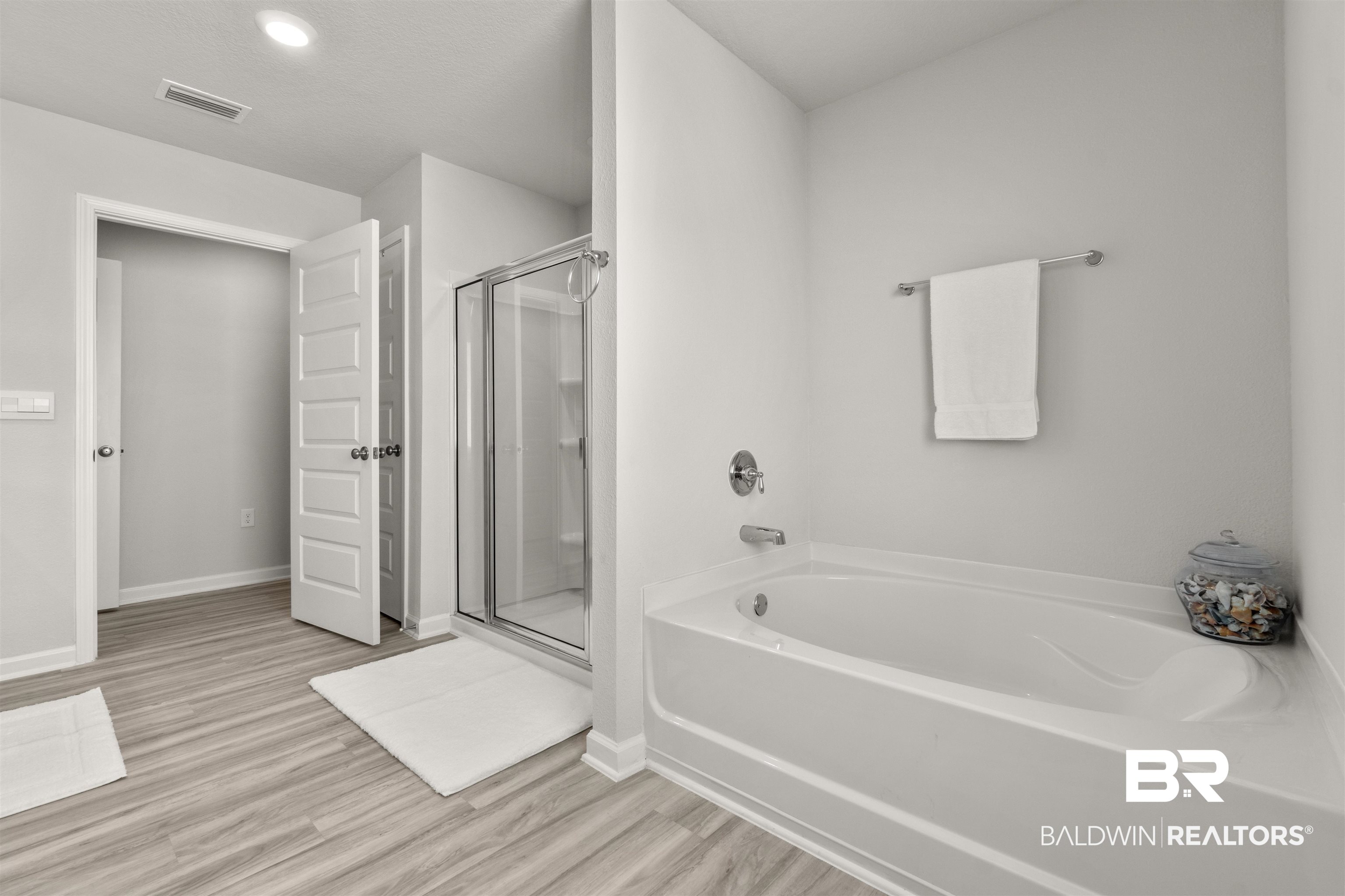 24472 Ringneck Loop Elberta, AL 36530 - Photo 23 of 46 Bathroom featuring hardwood / wood-style floors and separate shower and tub