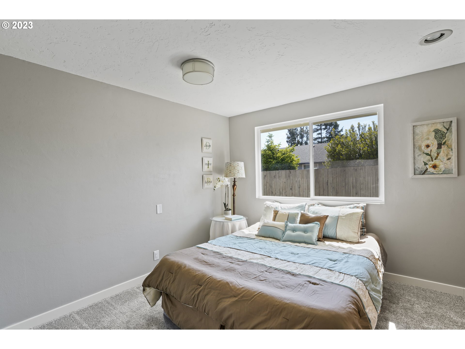 2232 24th Street Florence, OR 97439 - Photo 24 of 38 a bedroom with a bed and window