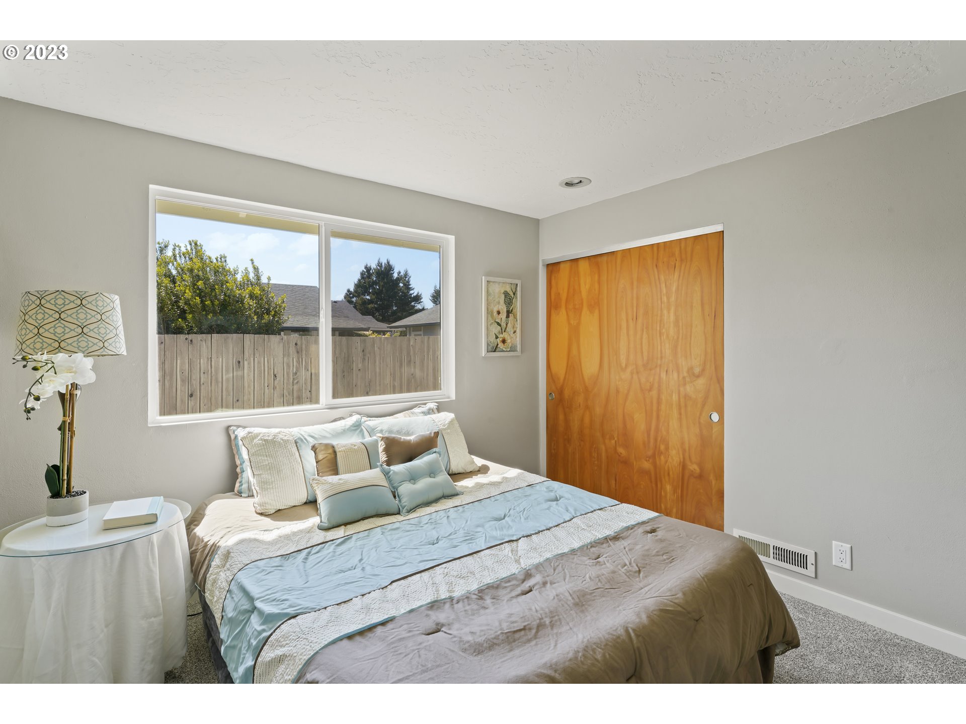 2232 24th Street Florence, OR 97439 - Photo 25 of 38 a bedroom with a bed and a window