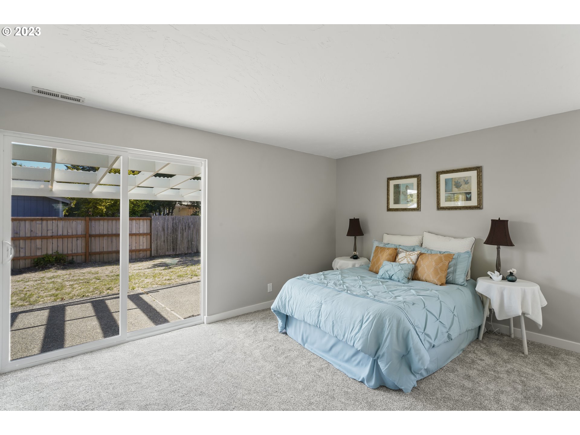 2232 24th Street Florence, OR 97439 - Photo 30 of 38 a bedroom with a bed and glass window