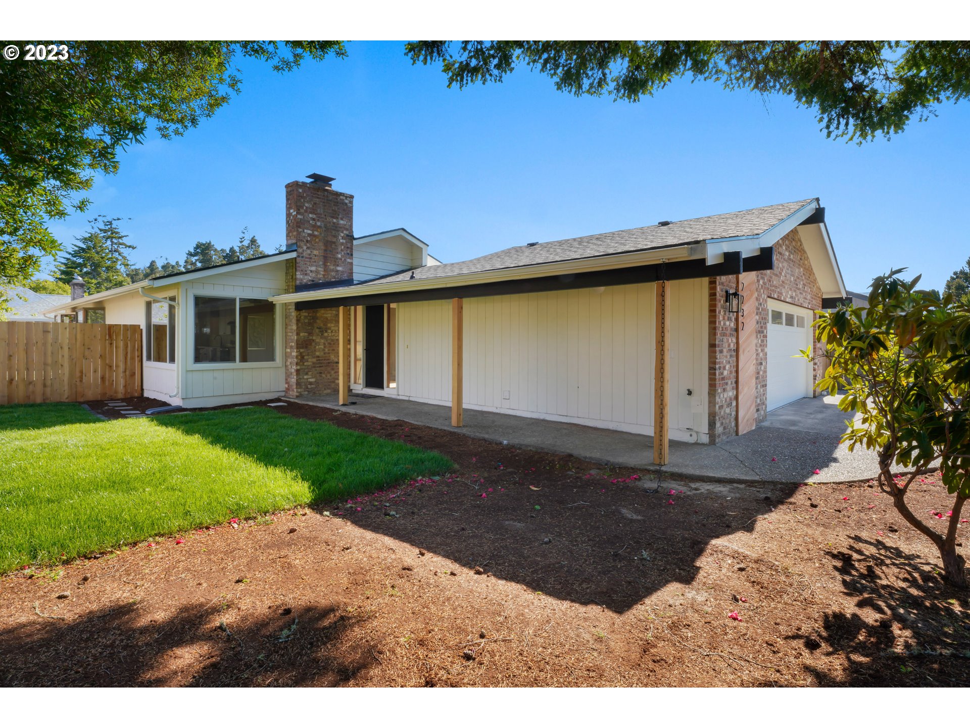 2232 24th Street Florence, OR 97439 - Photo 4 of 38 a front view of a house with garden