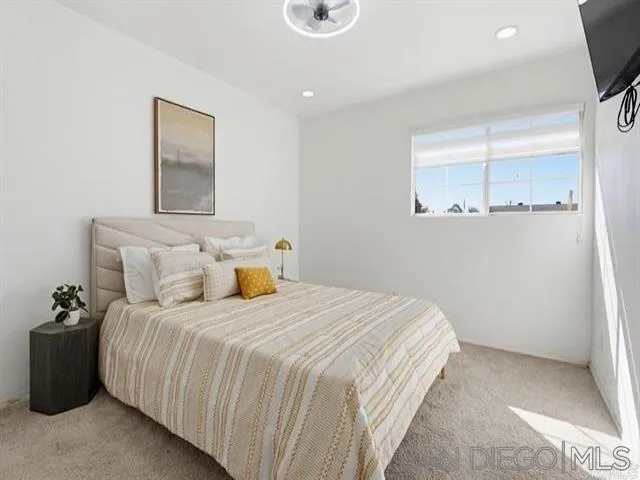 9462 Doheny Road Santee, CA 92071 - Photo 2 of 33 a bedroom with a bed and a window