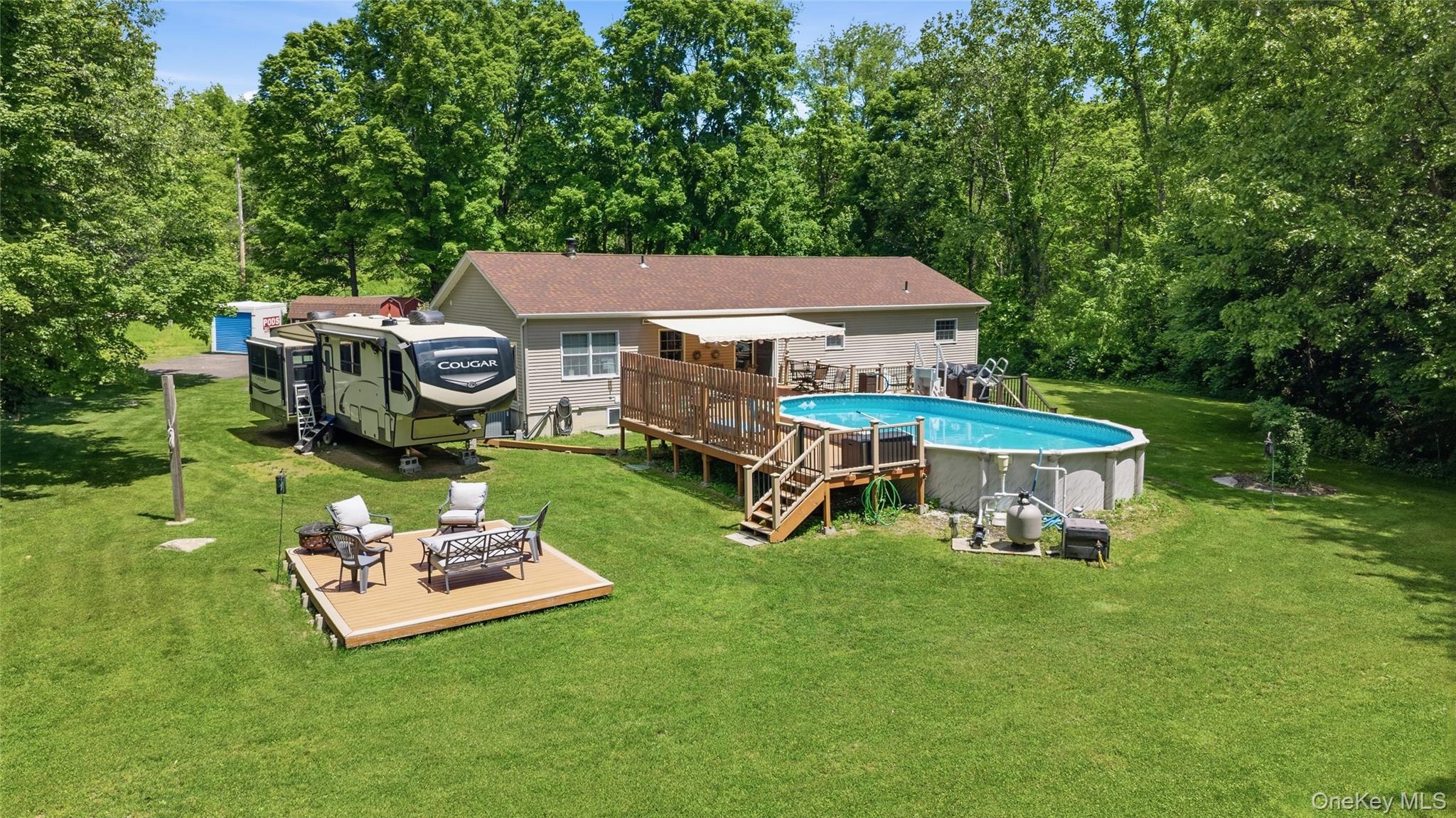 239-241 Fosler Road Highland, NY 12528 - Photo 5 of 42 Expansive backyard featuring a large above-ground pool with a surrounding wood deck