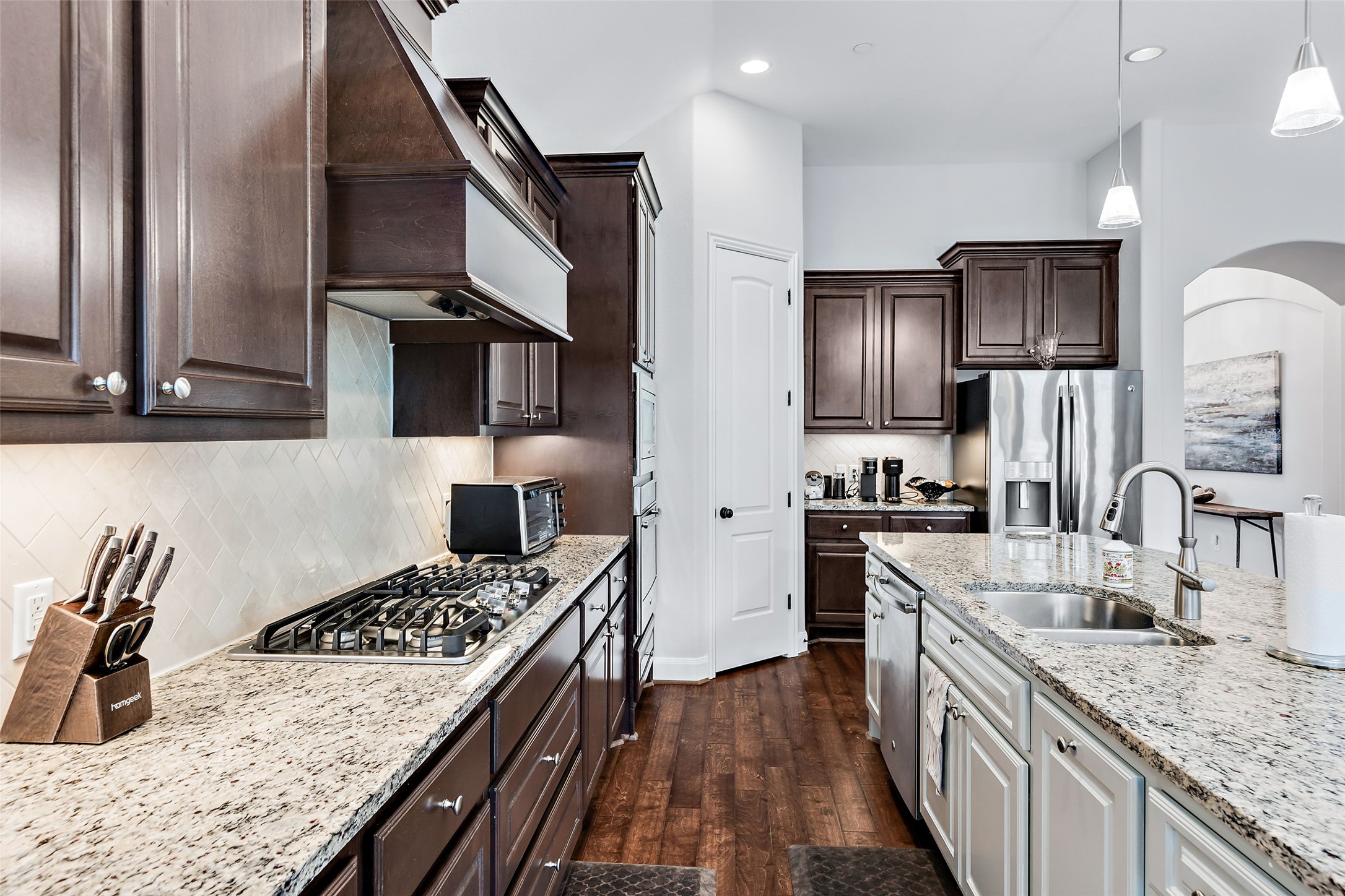 106 Maxwell Way Austin, TX 78738 - Photo 27 of 40 Kitchen featuring stainless steal appliances and gas cooktop