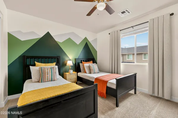 a bedroom with a bed and a dresser