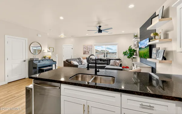a kitchen with counter space a sink and appliances