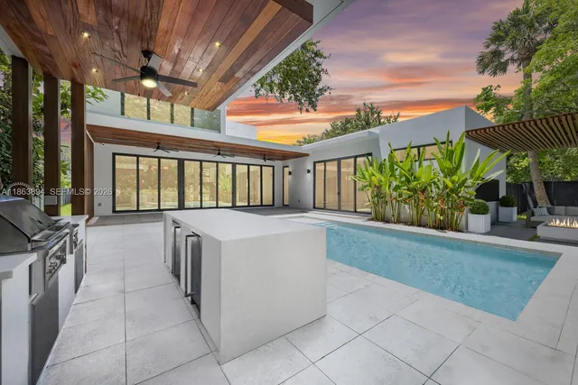 a view of a house with a yard and pathway