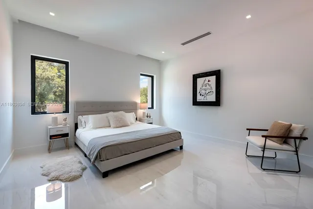 a bathroom with a toilet a sink and a mirror