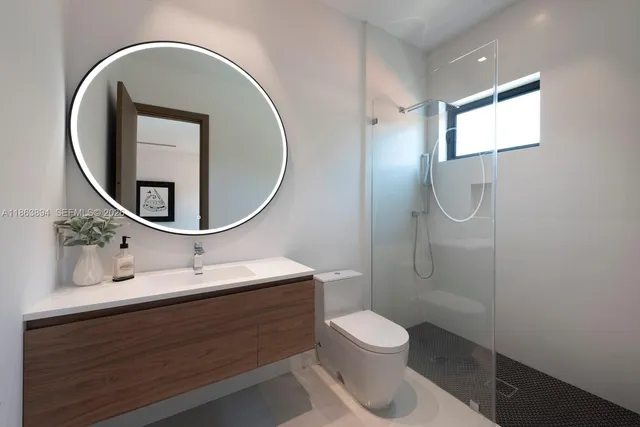 a living room with furniture and large windows