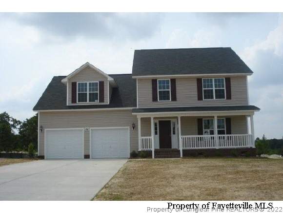 184 Rockingham Street Spring Lake, NC 28390 - Photo 1 of 1 a front view of a house with a yard