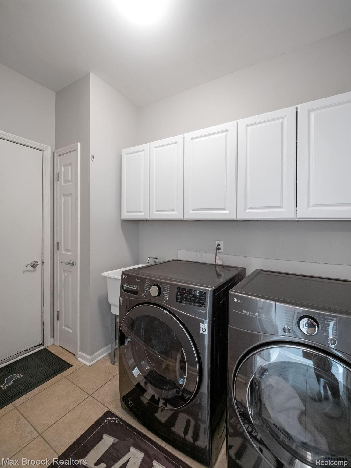 41491 Mitchell Road Novi, MI 48377 - Photo 25 of 28 Laundry room on first floor with closet and cabinets for storage.
