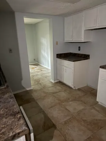a kitchen with a sink and cabinets