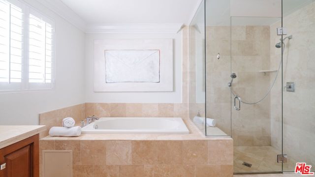 a bathroom with a bathtub and shower