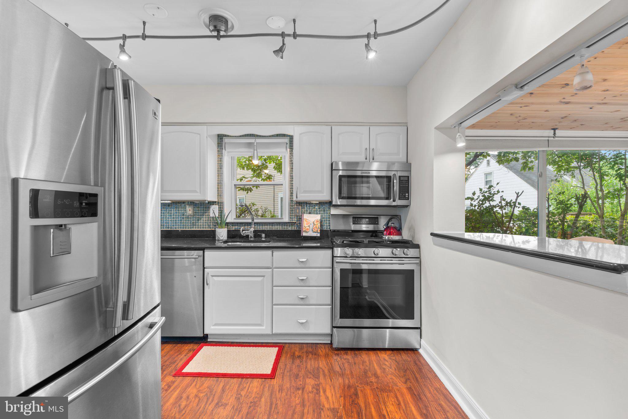 1605 Gridley Lane Silver Spring, MD 20902 - Photo 8 of 42 White Euro Kitchen with SS appliances!