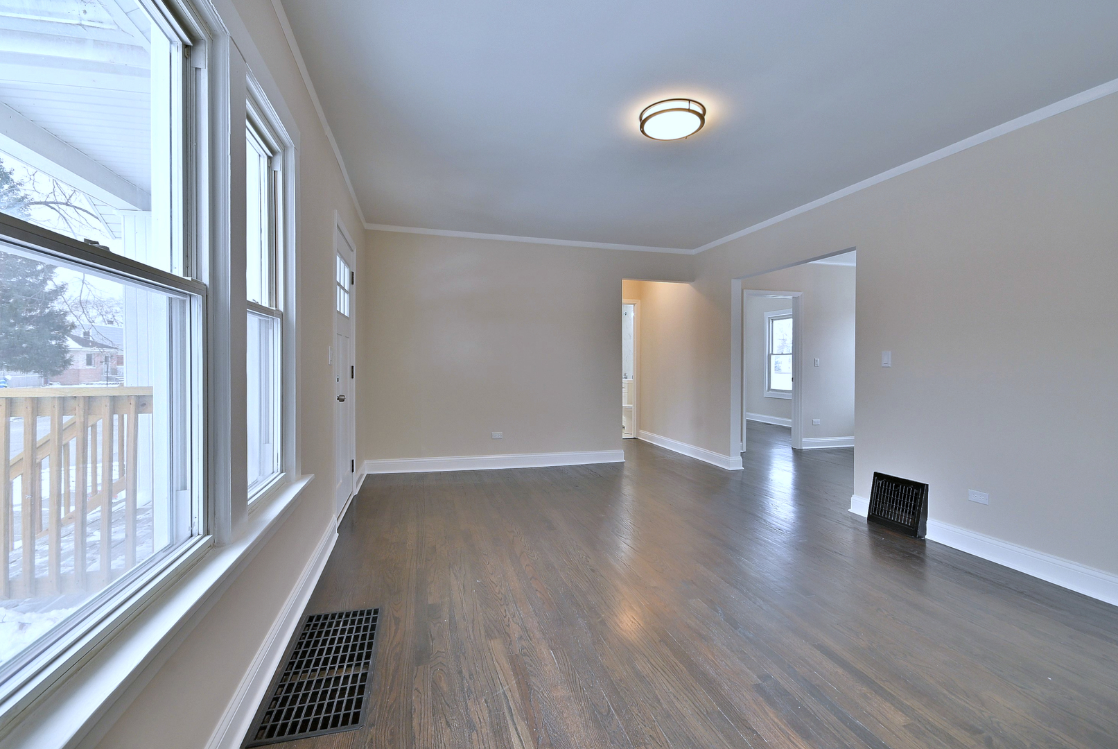 9016 Southview Avenue Brookfield, IL 60513 - Photo 12 of 45 a view of an empty room with wooden floor and a window