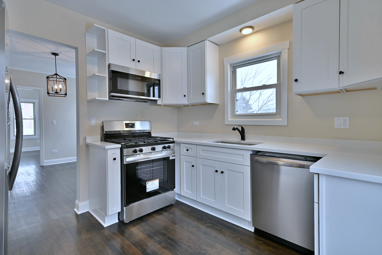 9016 Southview Avenue Brookfield, IL 60513 - Photo 22 of 45 a kitchen with stainless steel appliances a sink cabinets and a window