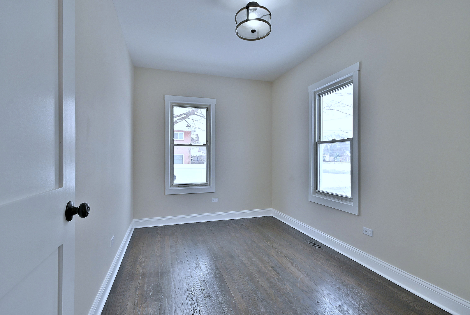 9016 Southview Avenue Brookfield, IL 60513 - Photo 26 of 45 an empty room with wooden floor and windows