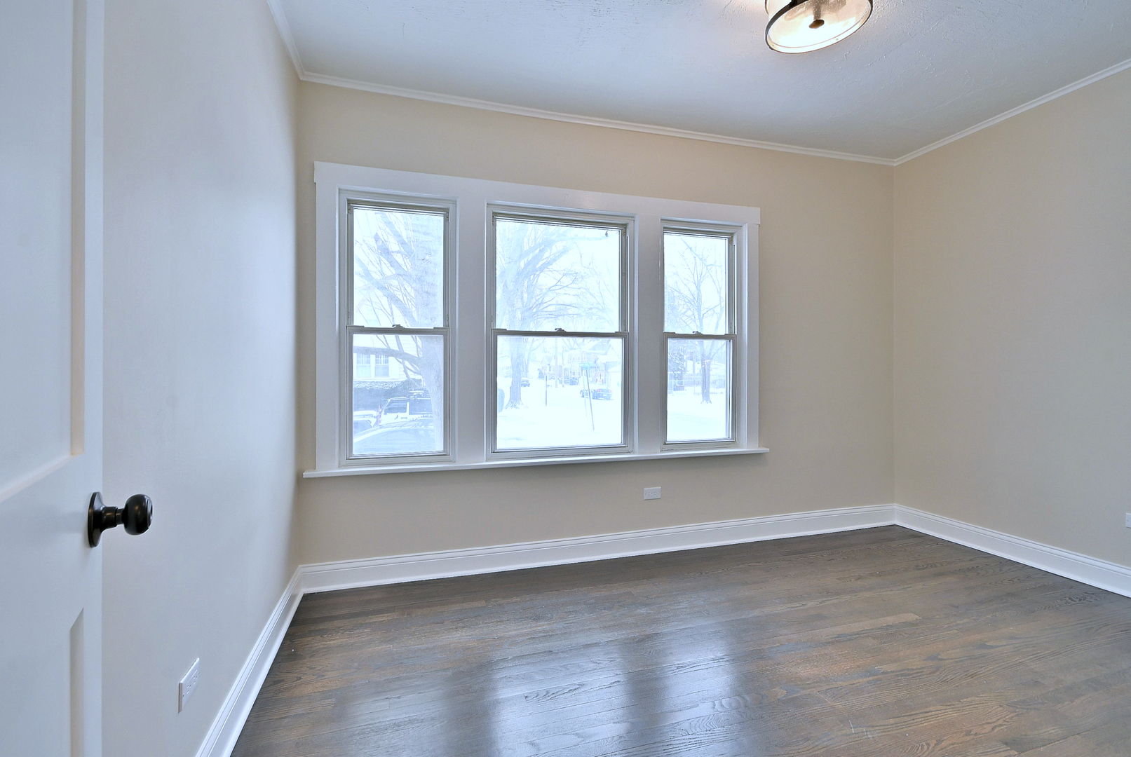 9016 Southview Avenue Brookfield, IL 60513 - Photo 29 of 45 an empty room with wooden floor and windows