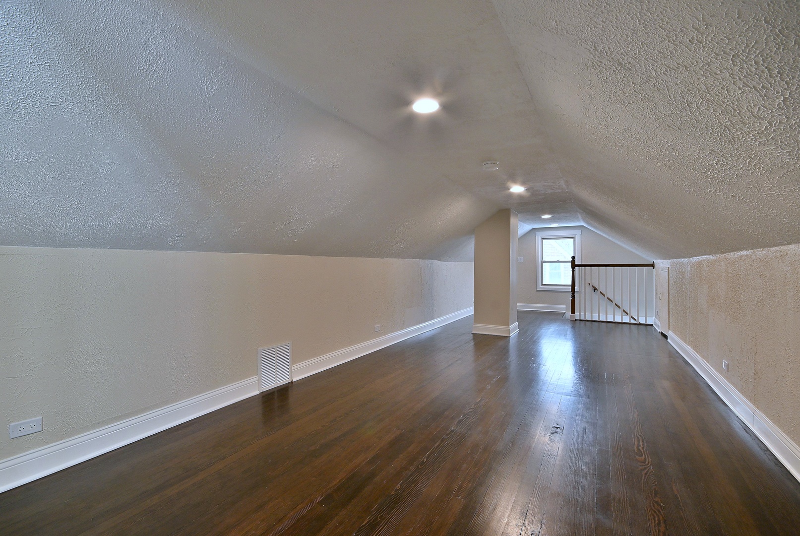 9016 Southview Avenue Brookfield, IL 60513 - Photo 32 of 45 a view of an empty room with wooden floor and a window