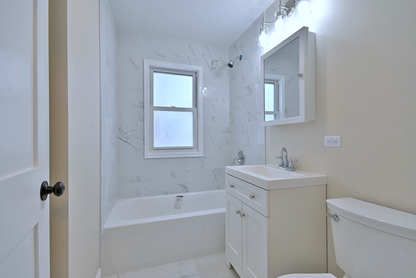 9016 Southview Avenue Brookfield, IL 60513 - Photo 36 of 45 a bathroom with a sink toilet vanity tub and shower
