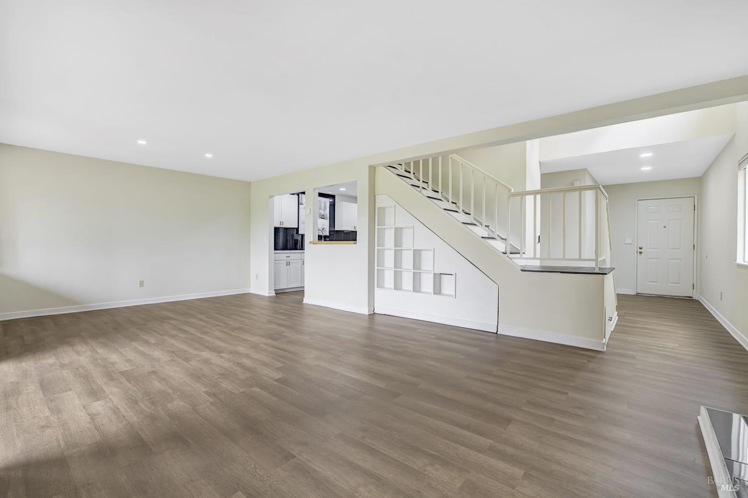 870 Hudis Street Rohnert Park, CA 94928 - Photo 15 of 49 a view of an empty room with wooden floor and stairs