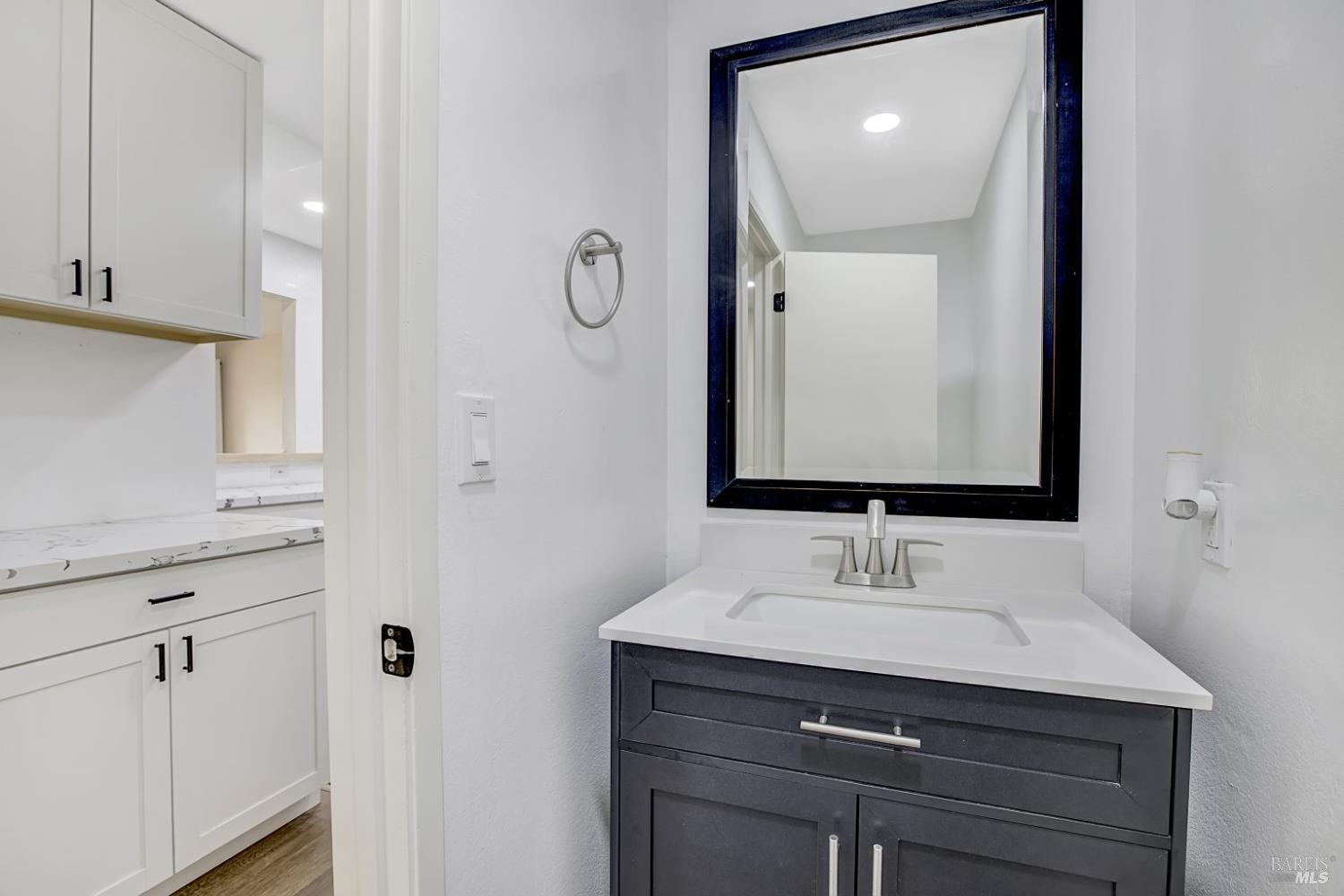 870 Hudis Street Rohnert Park, CA 94928 - Photo 18 of 49 a bathroom with a sink vanity and a mirror