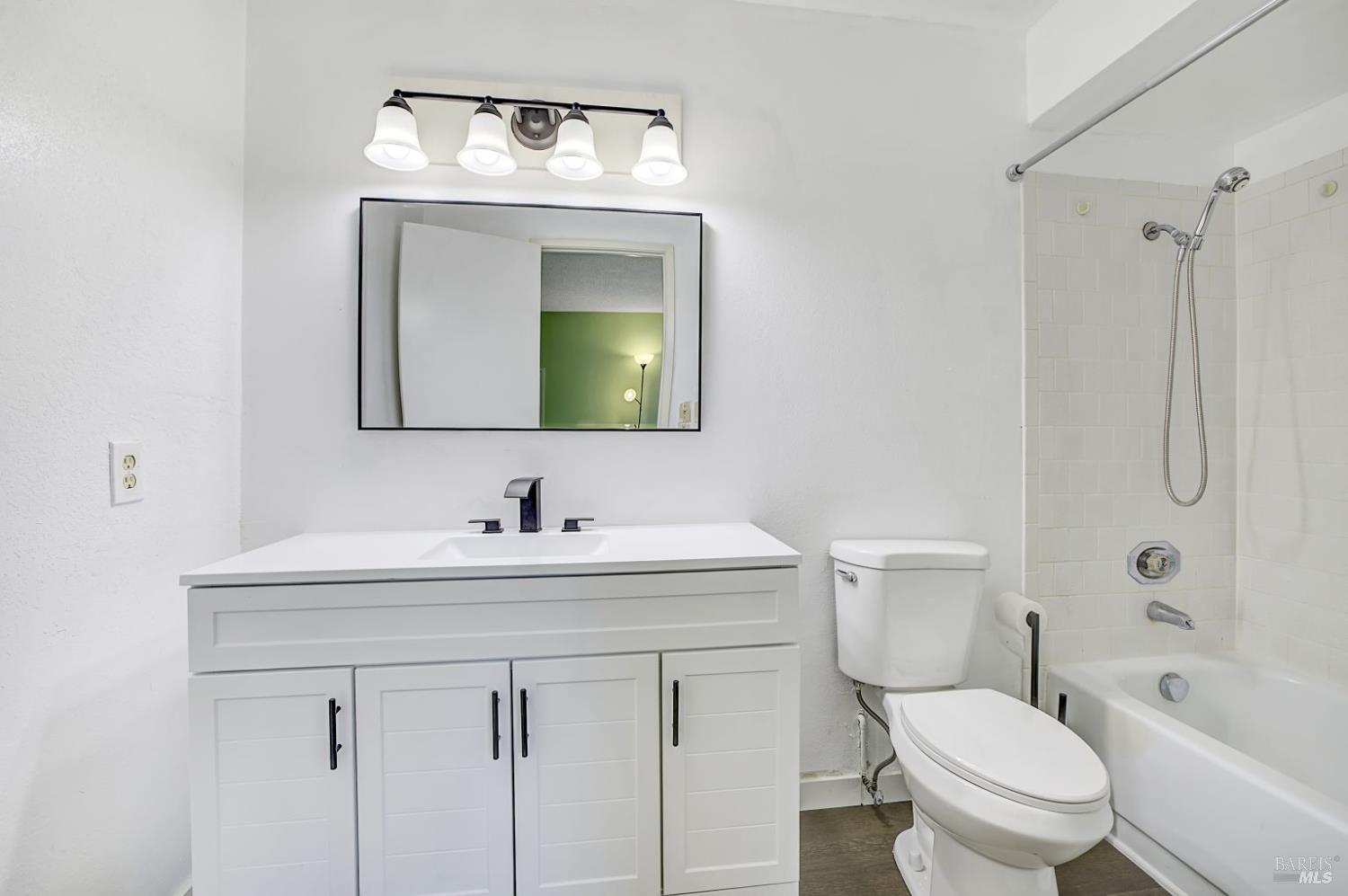870 Hudis Street Rohnert Park, CA 94928 - Photo 23 of 49 a bathroom with a toilet sink and mirror